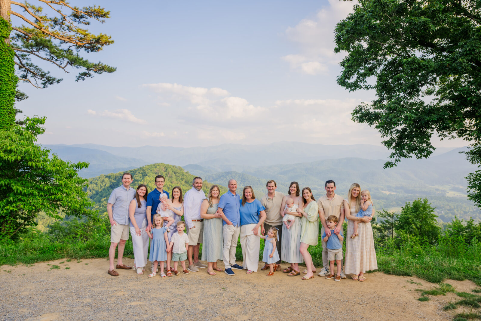 Large extended family has photos taken while on vacation together in Gatlinburg in the national park by a Gatlinburg Photographer