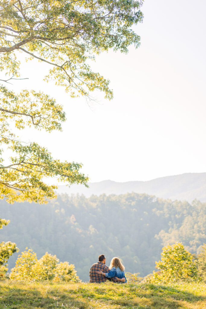 Couple from Illinois standing at an overlook during their engagement session at golden hour
