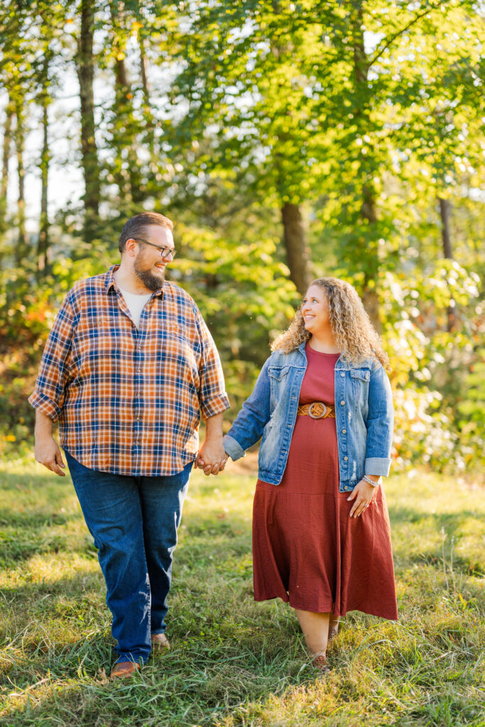 Romantic close-up of couple holding hands on a trail in Gatlinburg during their fall engagement session.