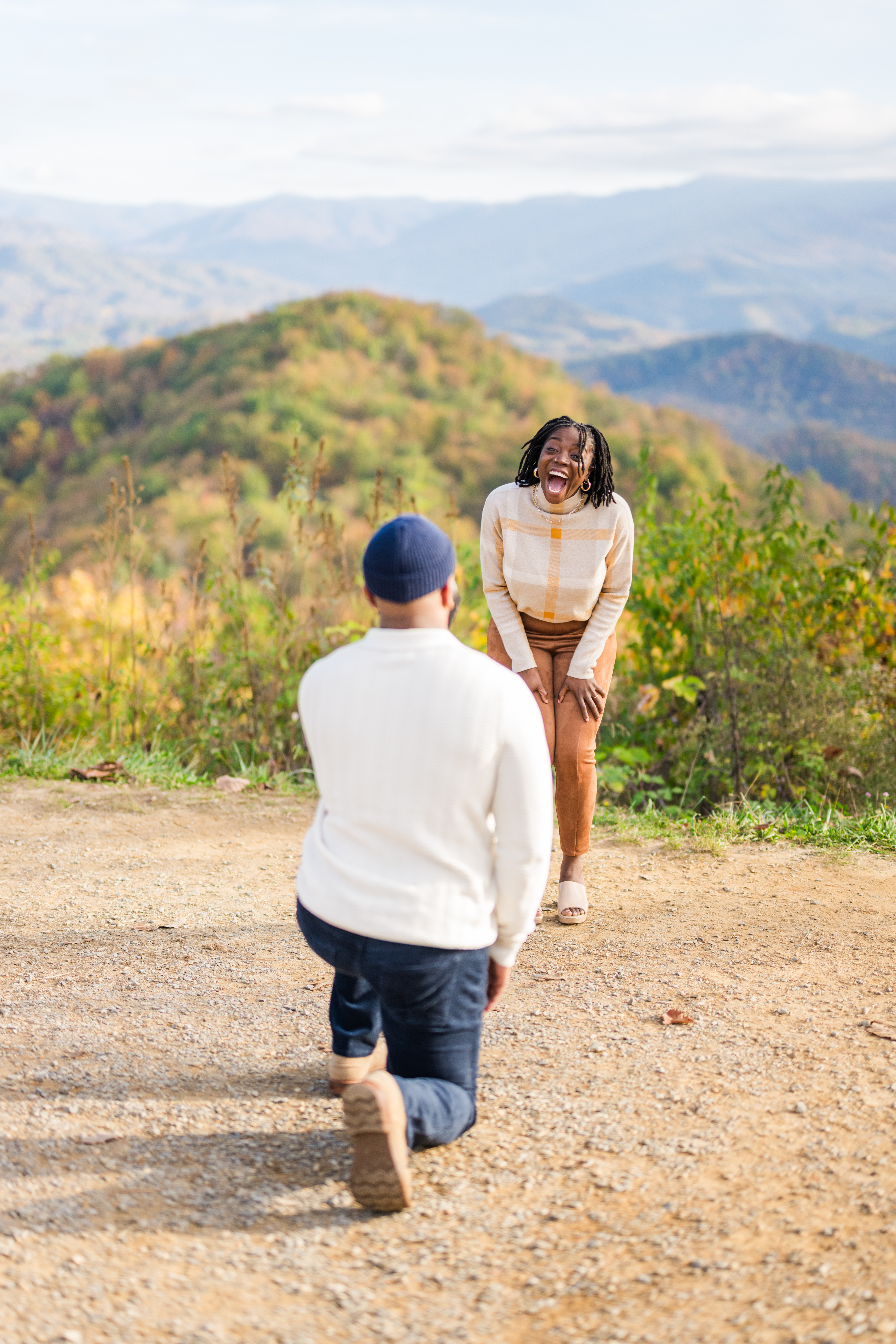 Man proposing to his girlfriend at a Mountain View overlook in Gatlinburg Tennessee