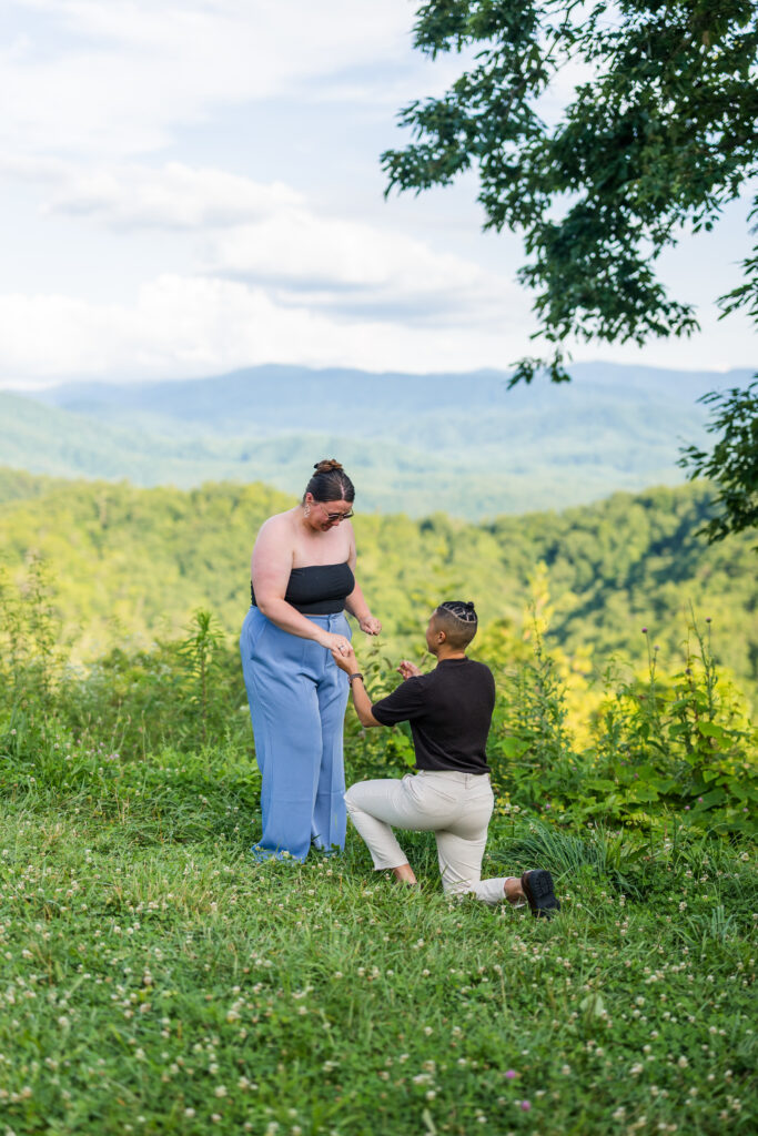 a woman proposing to her girlfriend in the smoky mountains national park in Townsend 