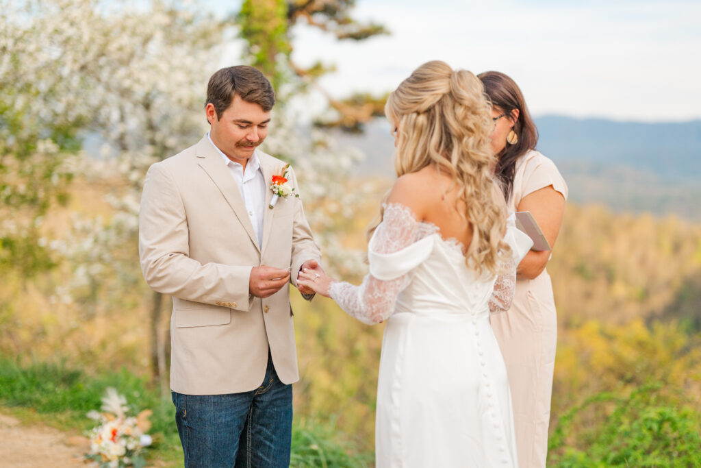 couple exchanging rings at a wedding ceremony in the Great Smoky Mountains National Park