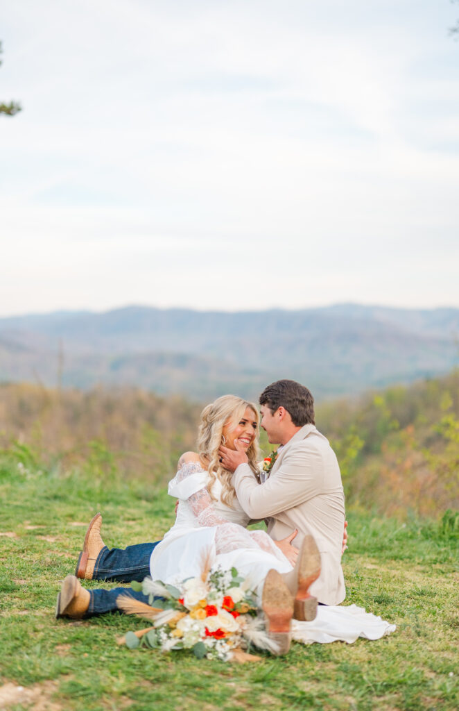 happy couple touching faces smiling after getting married in the smoky mountains 