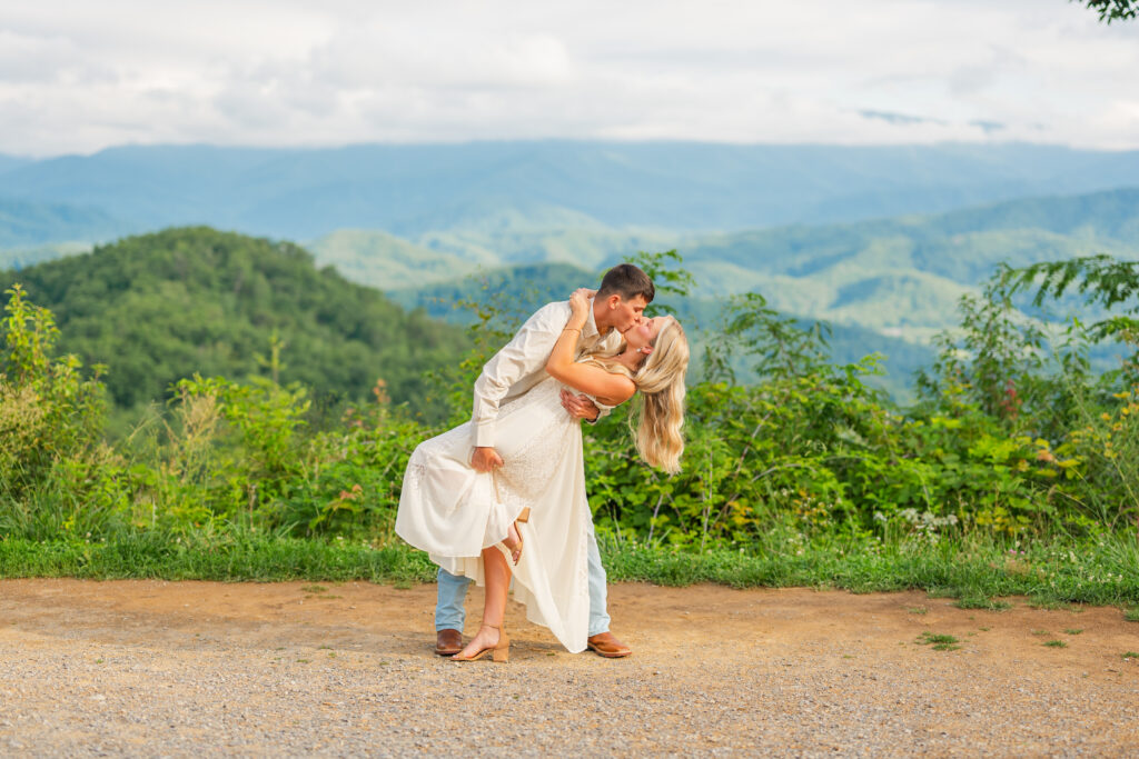 a couple dip kissing during their engagement session in the great smoky mountains national park.