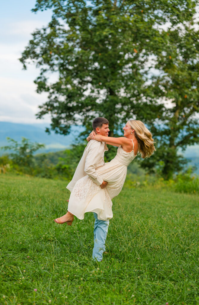 playing couple looking joyous in them mountains during engagement session in gatlinburg 